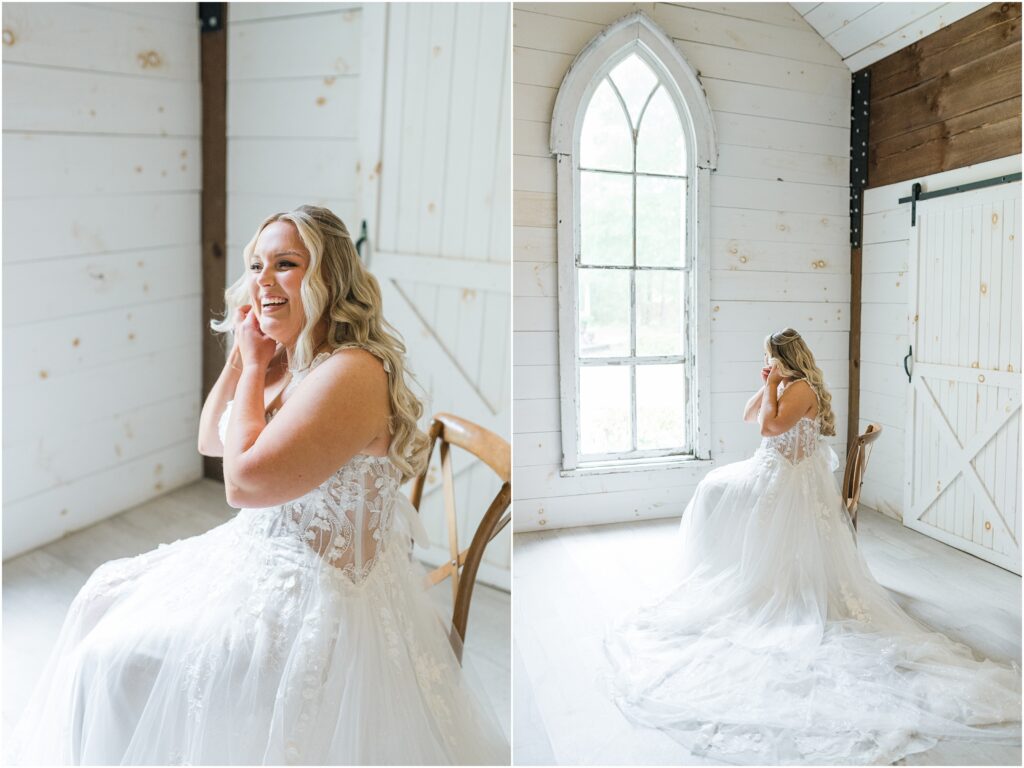 Bride putting on her earrings in front of a big window in Chandler Oaks Barn