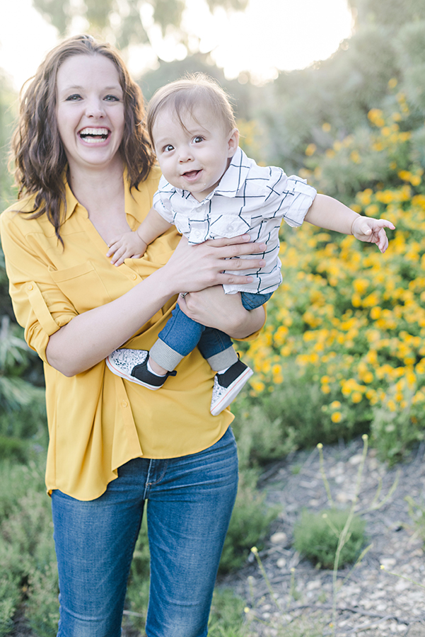 Baby boy and mom playing during family portrait session