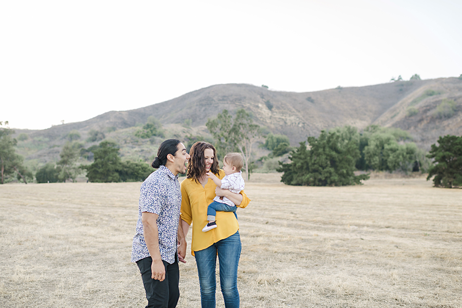 Candid family portrait in a California field