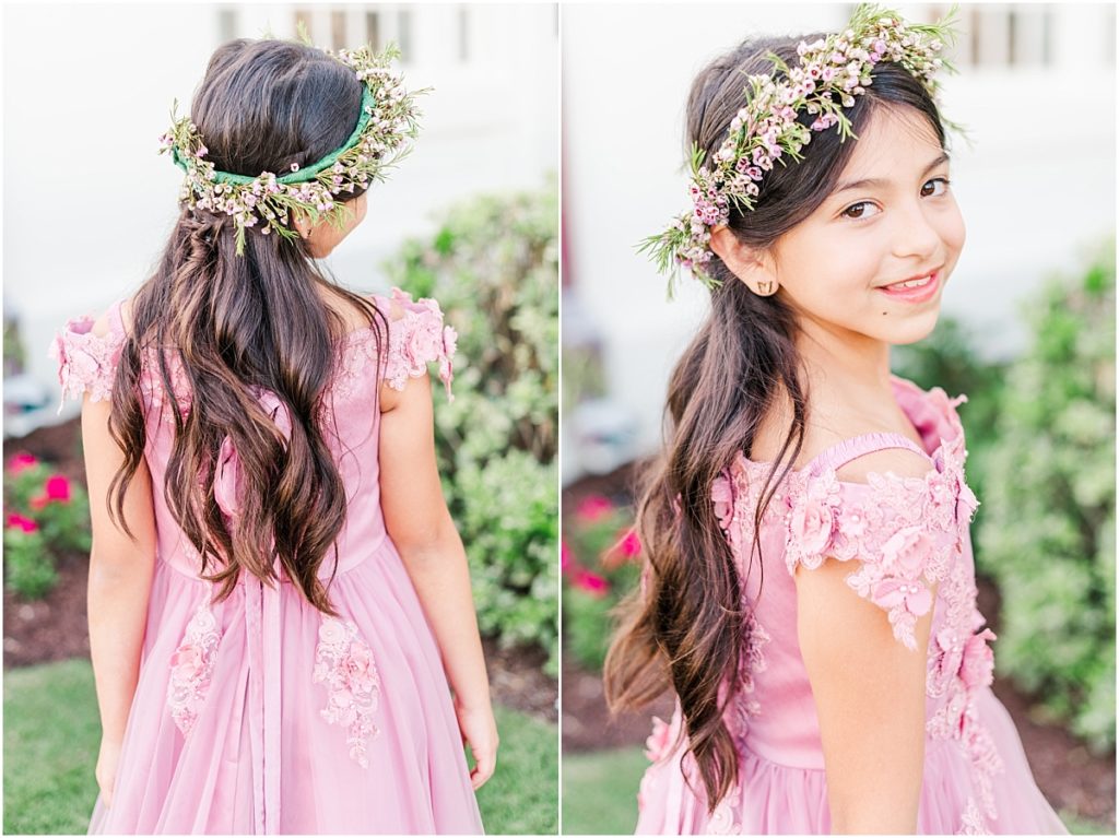 Flower girl in a pink dress with a flower crown