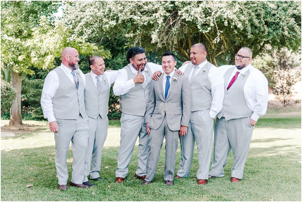 Groomsman pictures at a green Southern California Park
