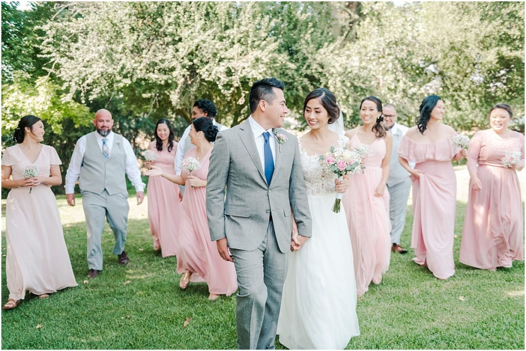 Bridal Party walking at a green Southern California Park