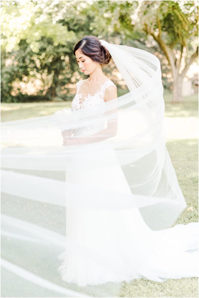 Bridal pictures with veil blowing