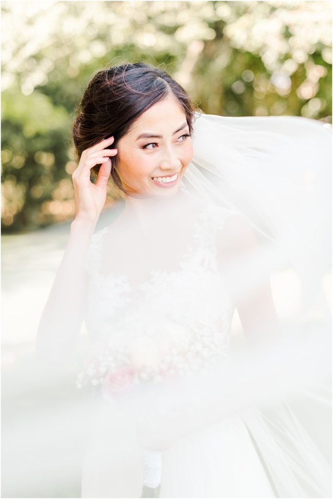 Bridal pictures with veil blowing