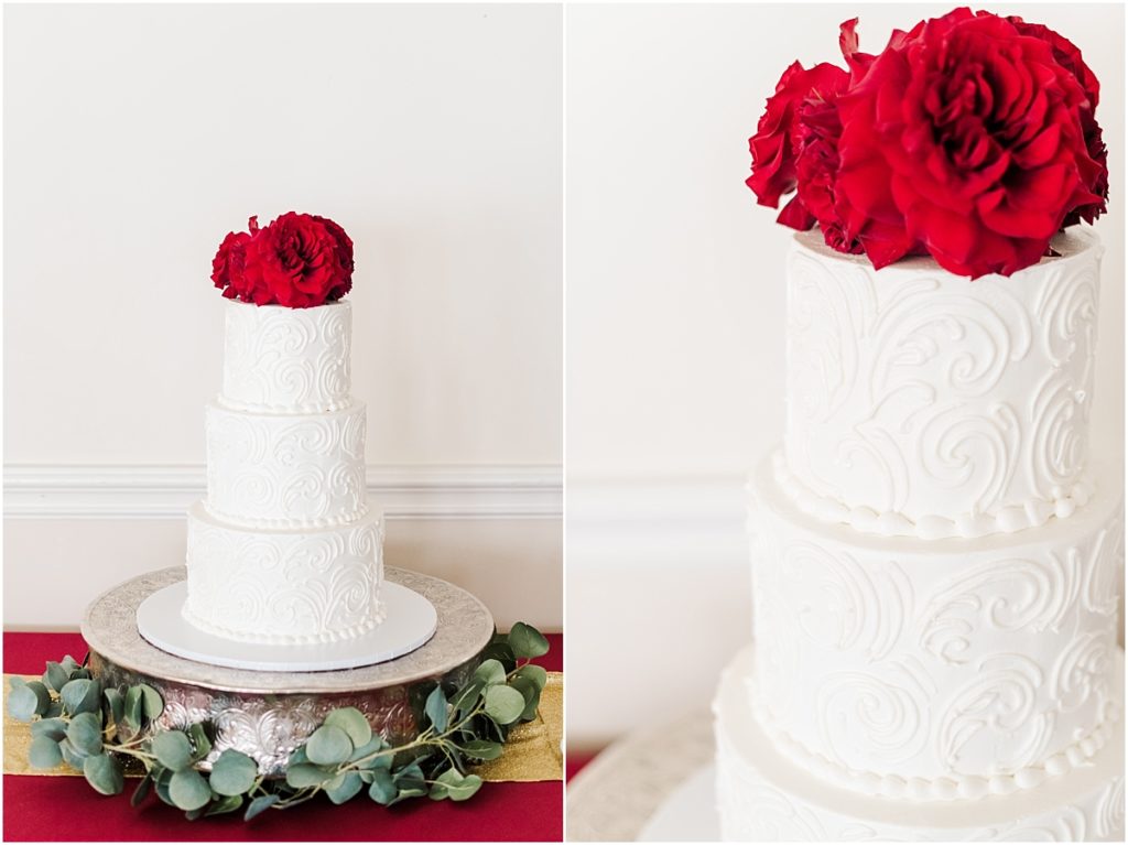 Wedding cake with red floral details at Ashton Gardens West