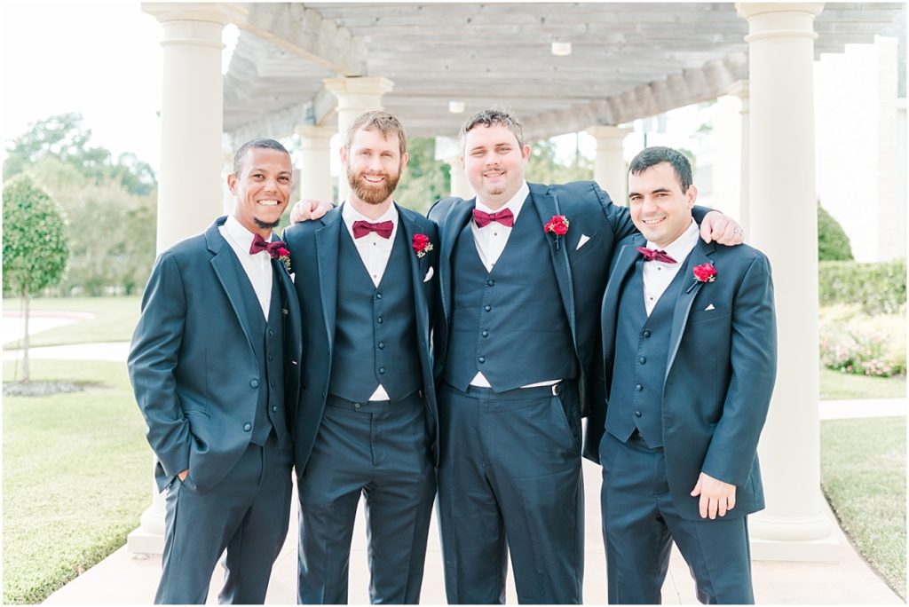 Groomsmen pictures at Ashton Gardens West with maroon bowties.