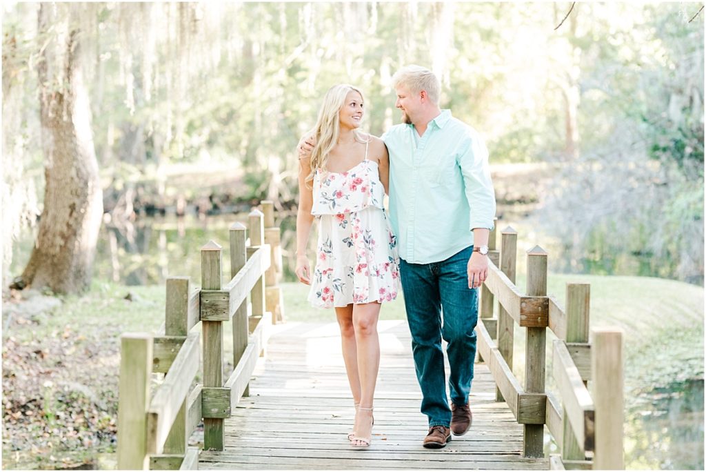 Cy-Hope Engagement Session on a bridge with hanging Spanish moss