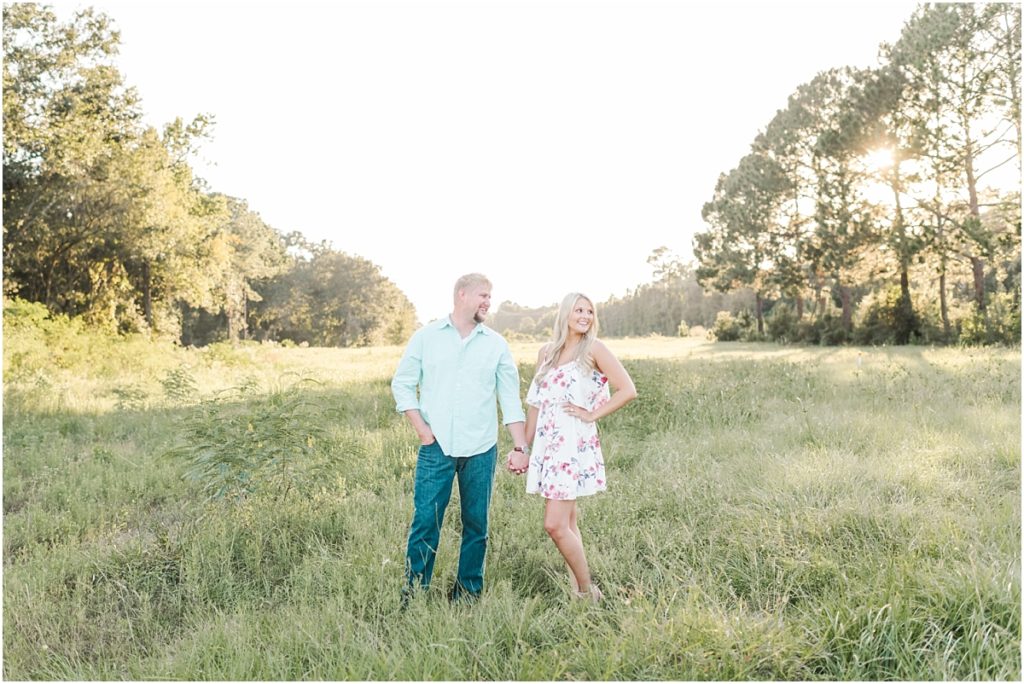 Cy-Hope Engagement session in open field with tall grass.