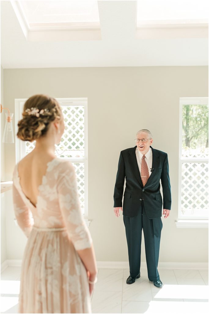 First look with dad in bridal suite at Forever 5 Events