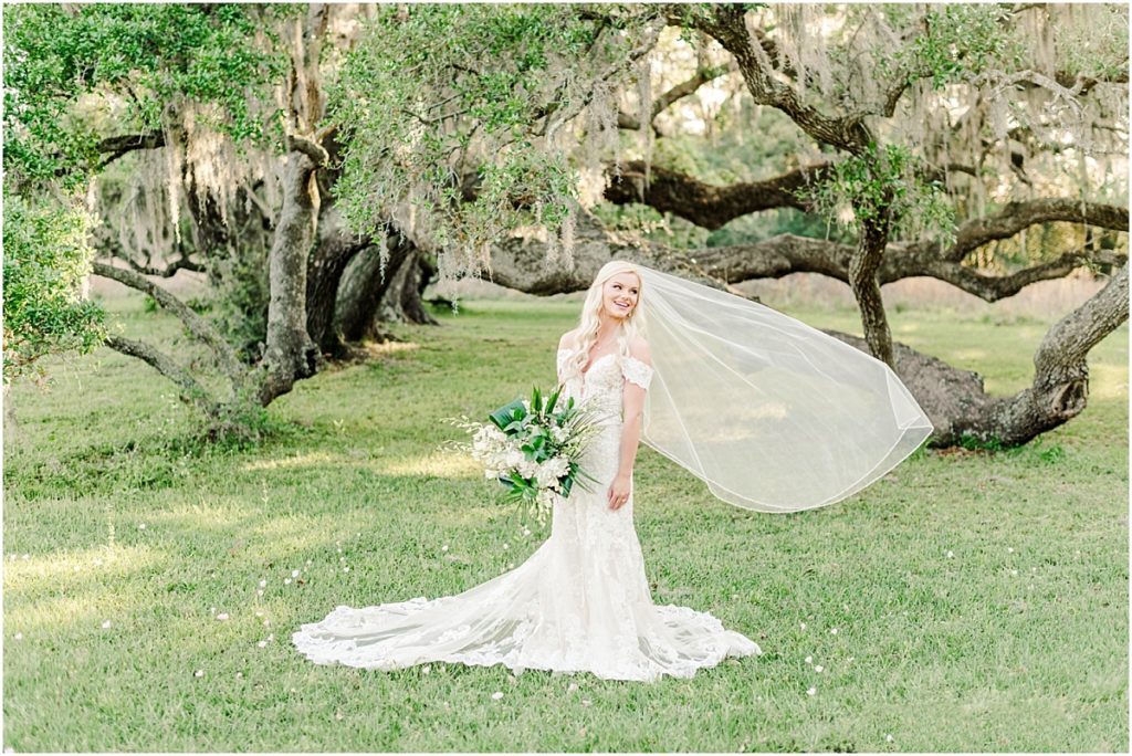 Beautiful bride wit veil flowing at Brazos Bend State Park