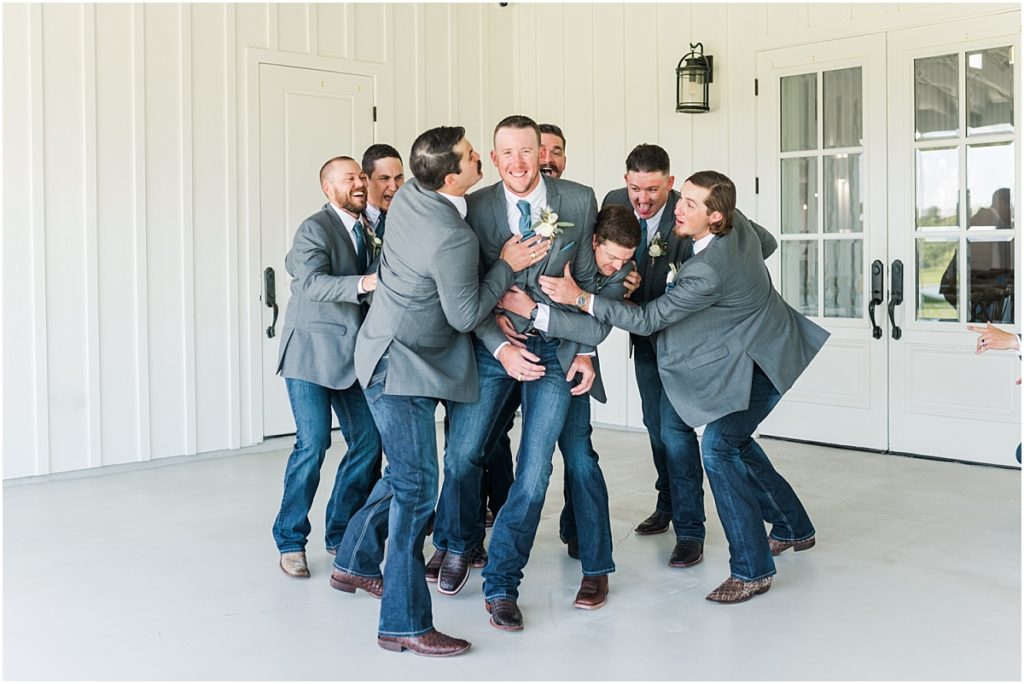 Groomsmen at the Farmhouse in dusty blue ties
