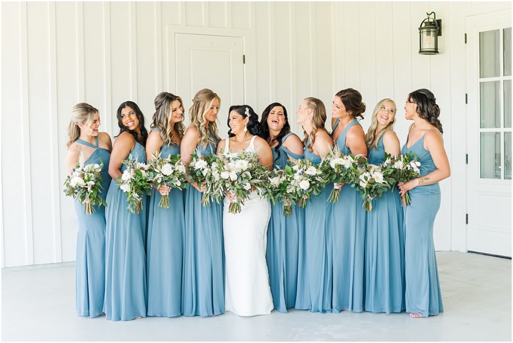 Bridesmaids in dusty blue dresses