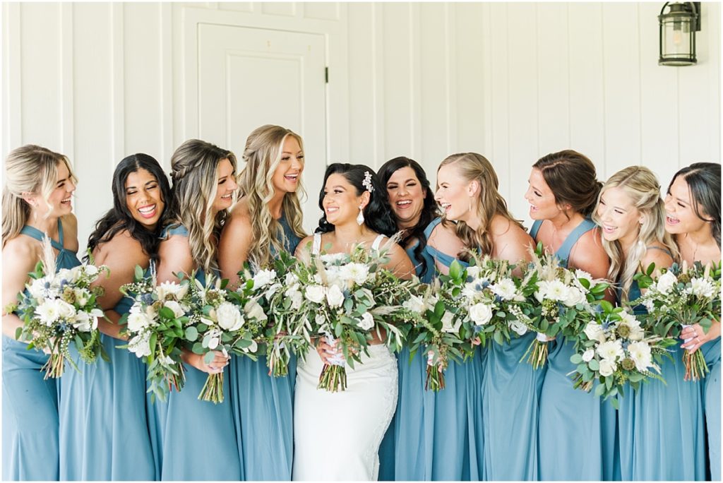 Bridesmaids in dusty blue dresses