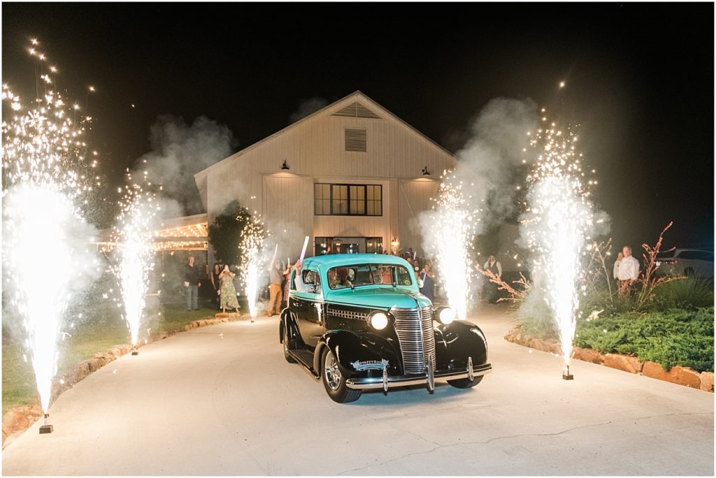 Vintage getaway car with cold sparks up the driveway at The Farmhouse