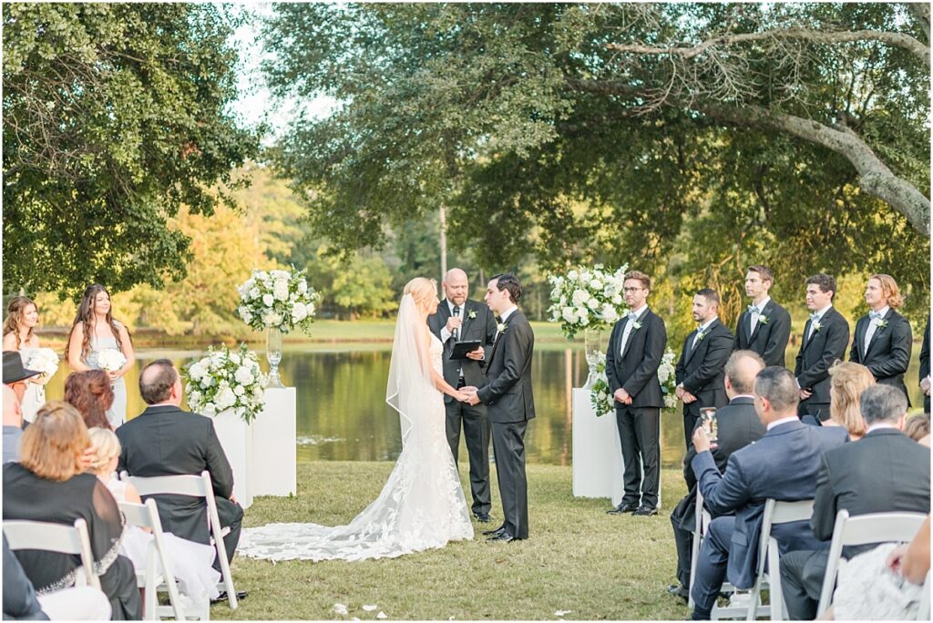 The Woodlands Wedding ceremony on a golf course next to a lake.