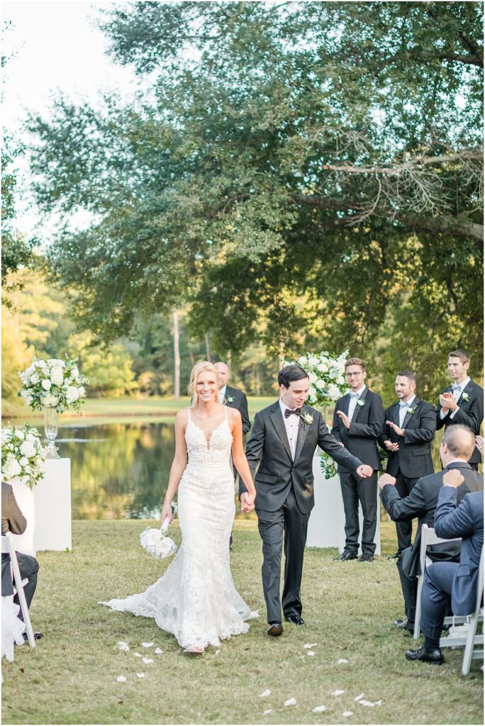 Groom fist bumps dad after wedding ceremony in The Woodlands