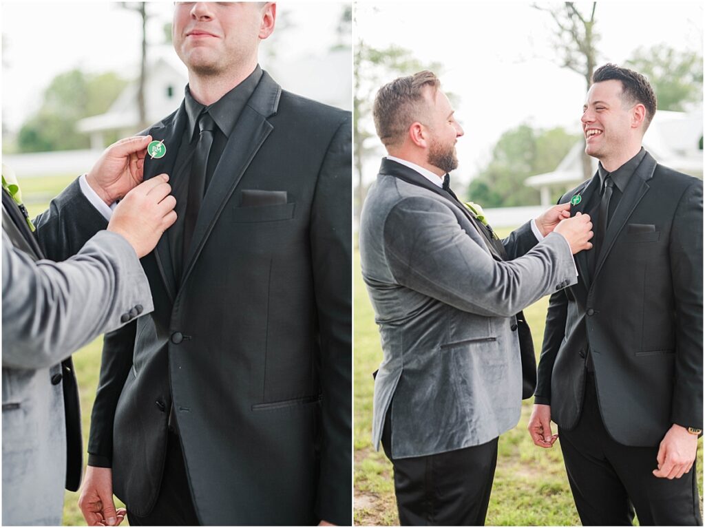Groom on his wedding day with a grey velvet suit helping the best man get ready.