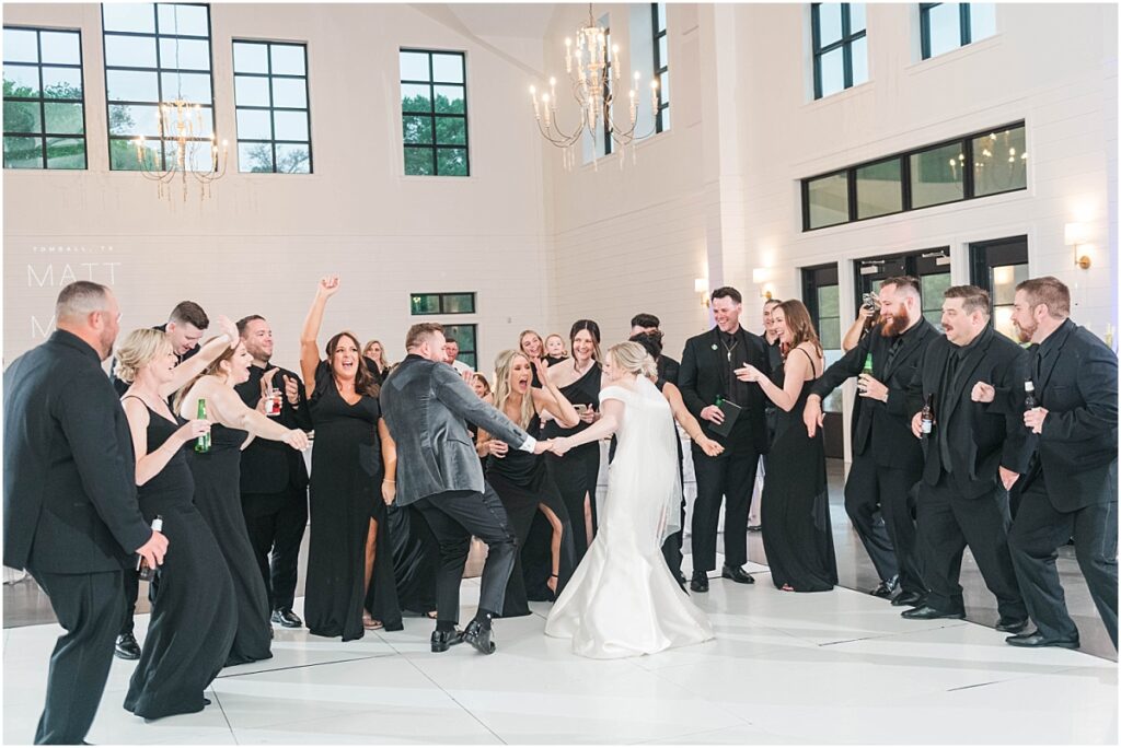 Bridal party dancing during grand entrance at Boxwood Manor