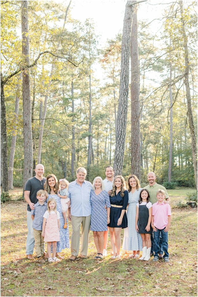 St Augustine extended family pictures in a park with trees.