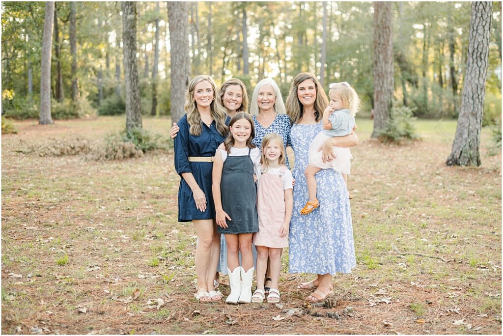 Grandma with her daughters and granddaughters during their St. Augustine extended family picture session at a park.