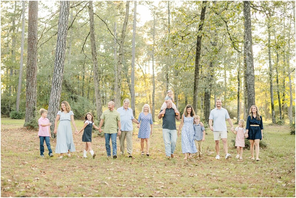 A family walking through a park during family pictures in Jacksonville Fl.