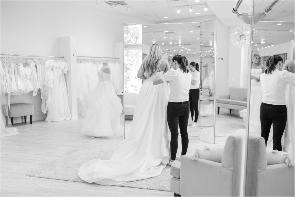 Trying on a wedding dress at a jacksonville florida wedding dress shop