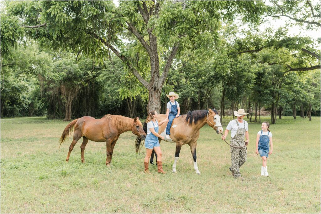 Walking with horse for their Houston family pictures