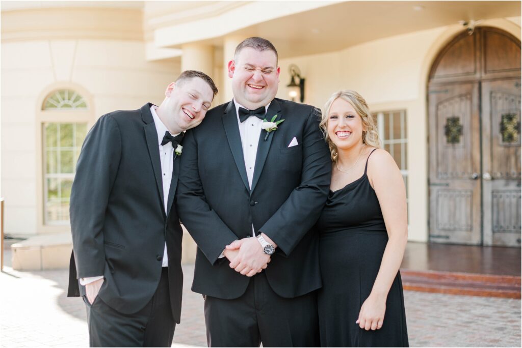 Sibling formal family pictures wearing black at St. Augustine wedding