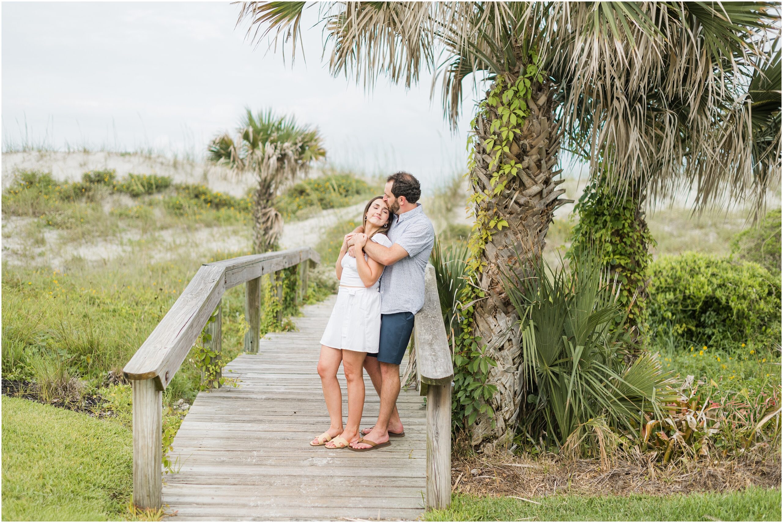 Engagement session in jacksonville on a beach path with palm trees