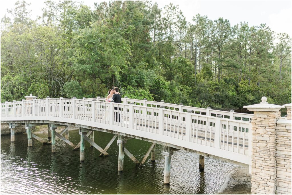 Bride and Groom on the St. Johns Golf & Country Club bridge on their wedding day.